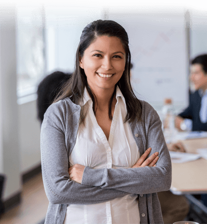 A front-facing, upper body shot of a woman in an office.