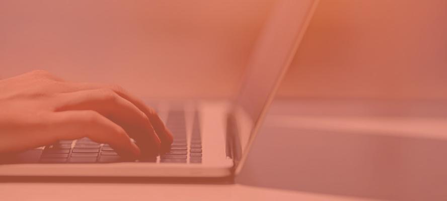 A close-up of someone typing on a computer.
